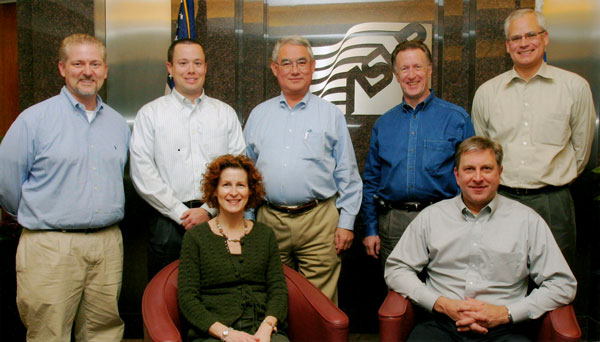 2007–2008 Section of Pharmacy Informatics and Technology Executive Committee (sitting, L–R) Lynnae Mahaney, John Poikonen; (standing, L–R) Karl Gumpper, Brent Fox, Jeff Ramirez, Dennis Tribble, and Mark Siska